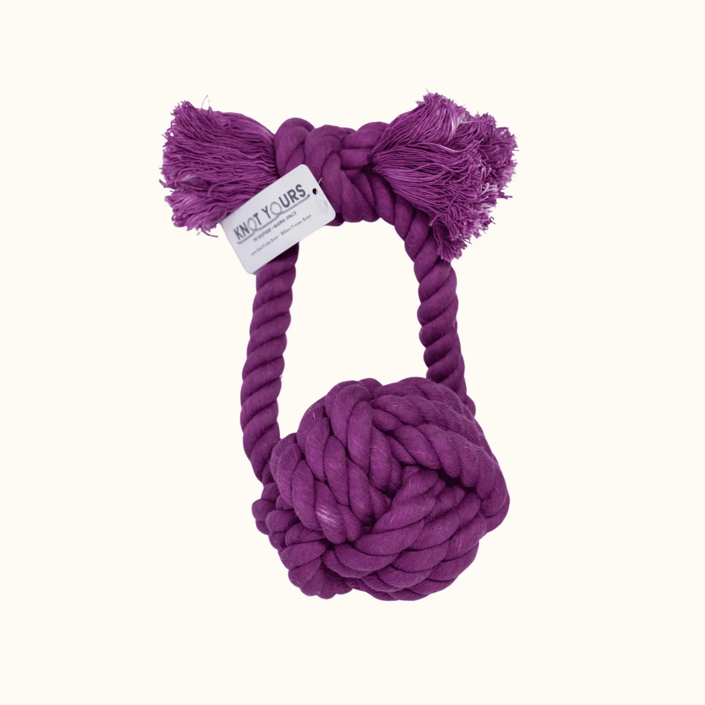 Giant Monkey Knot toy in rich eggplant purple, shown with a Knot Yours brand tag on the handle and textured cotton rope ends designed for play and durability.