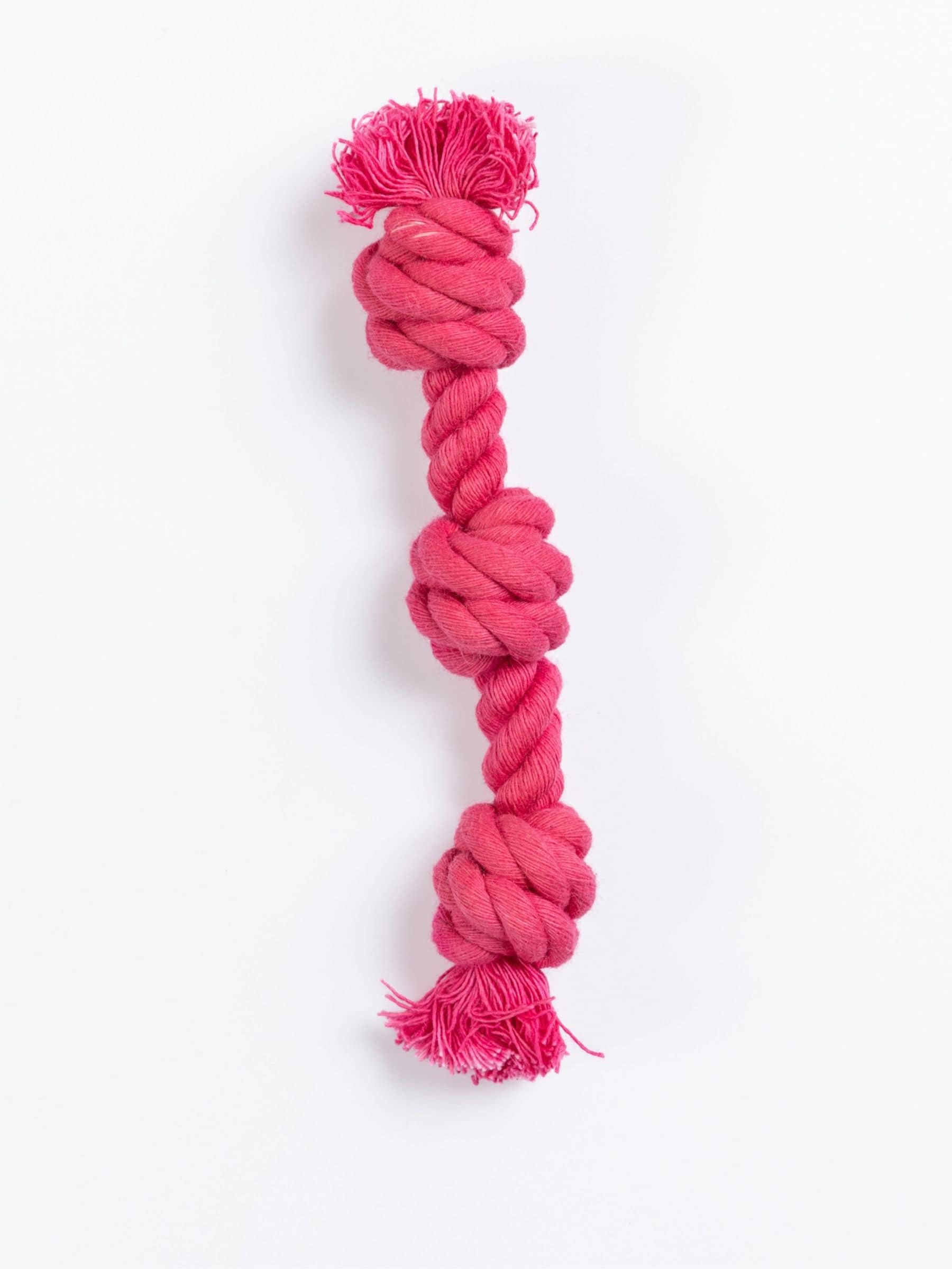 Bright fuchsia rope toy with three tied knots for tiny dogs, handmade and hand-dyed for solo play