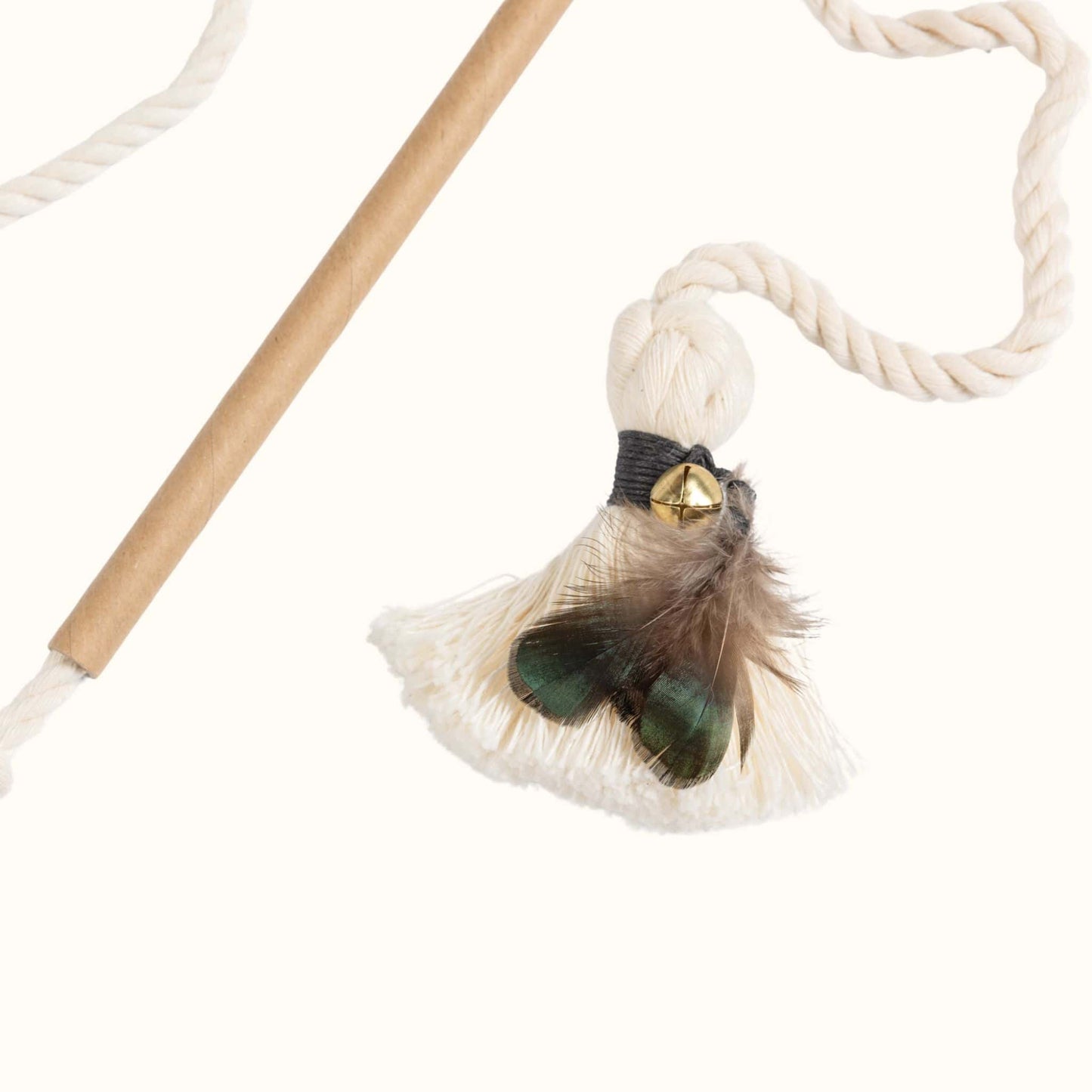Close-up of feather tassel attachment on an interactive cat wand toy, featuring a black wrap, gold bell, and green-brown feathers.