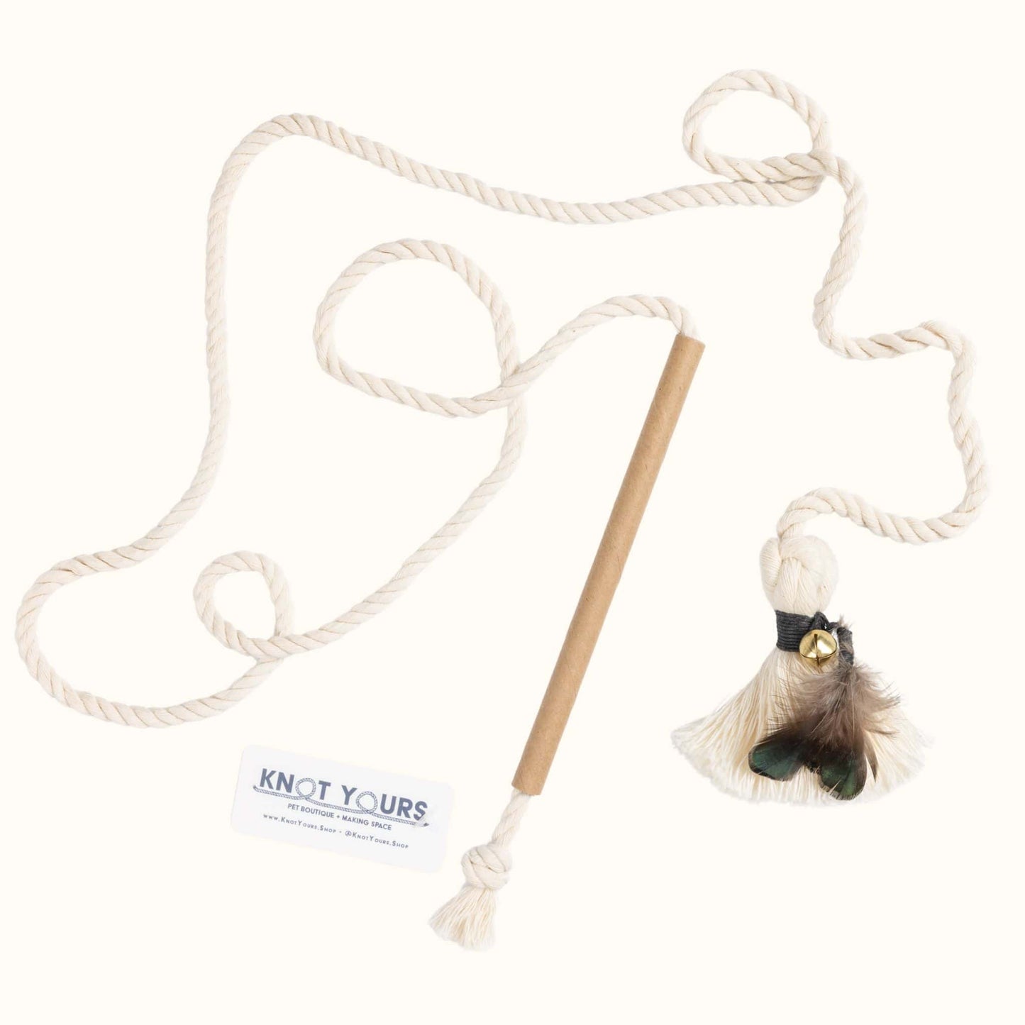 Interactive cat wand toy with a cardboard handle, long cotton rope, and black-banded feather tassel attachment for active play.