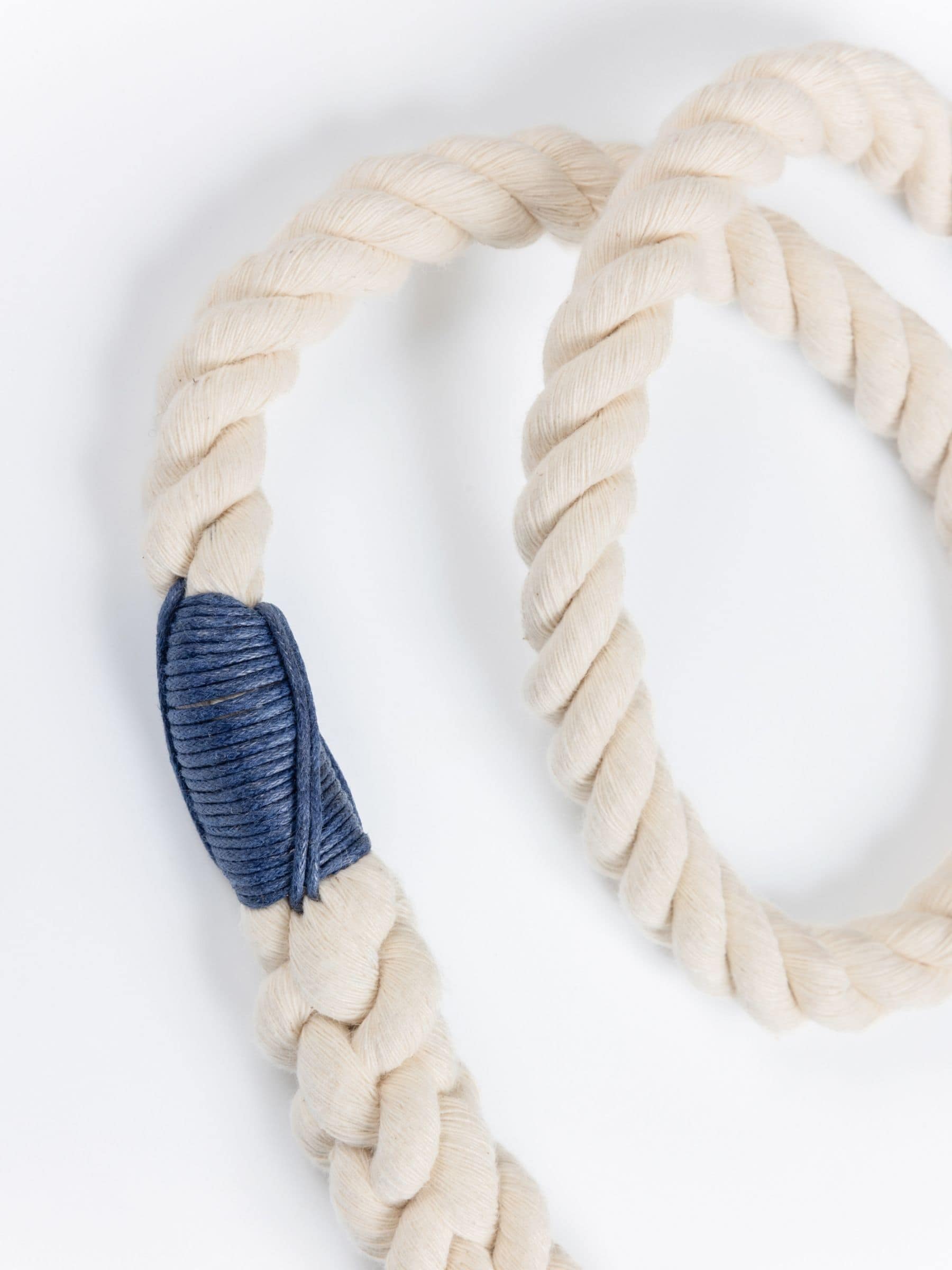Natural rope leash with a navy blue accent on a white background