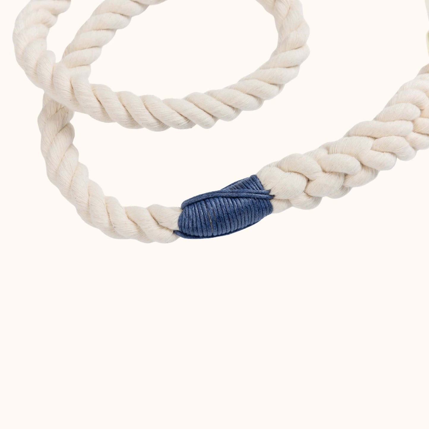 Natural rope leash with a navy blue accent on a white background