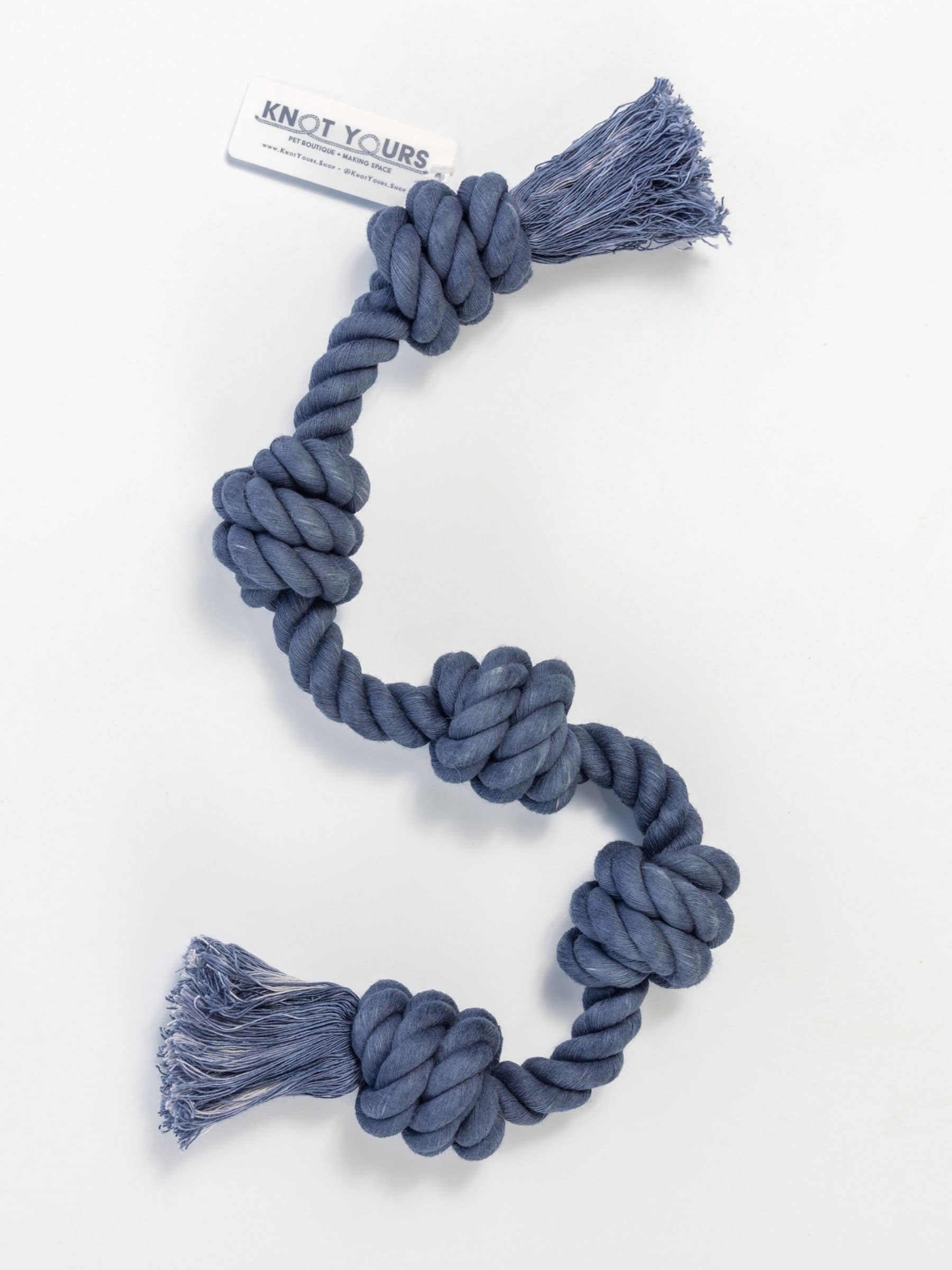 Navy Little Gigantic rope dog toy with tassels and five knots on a white background