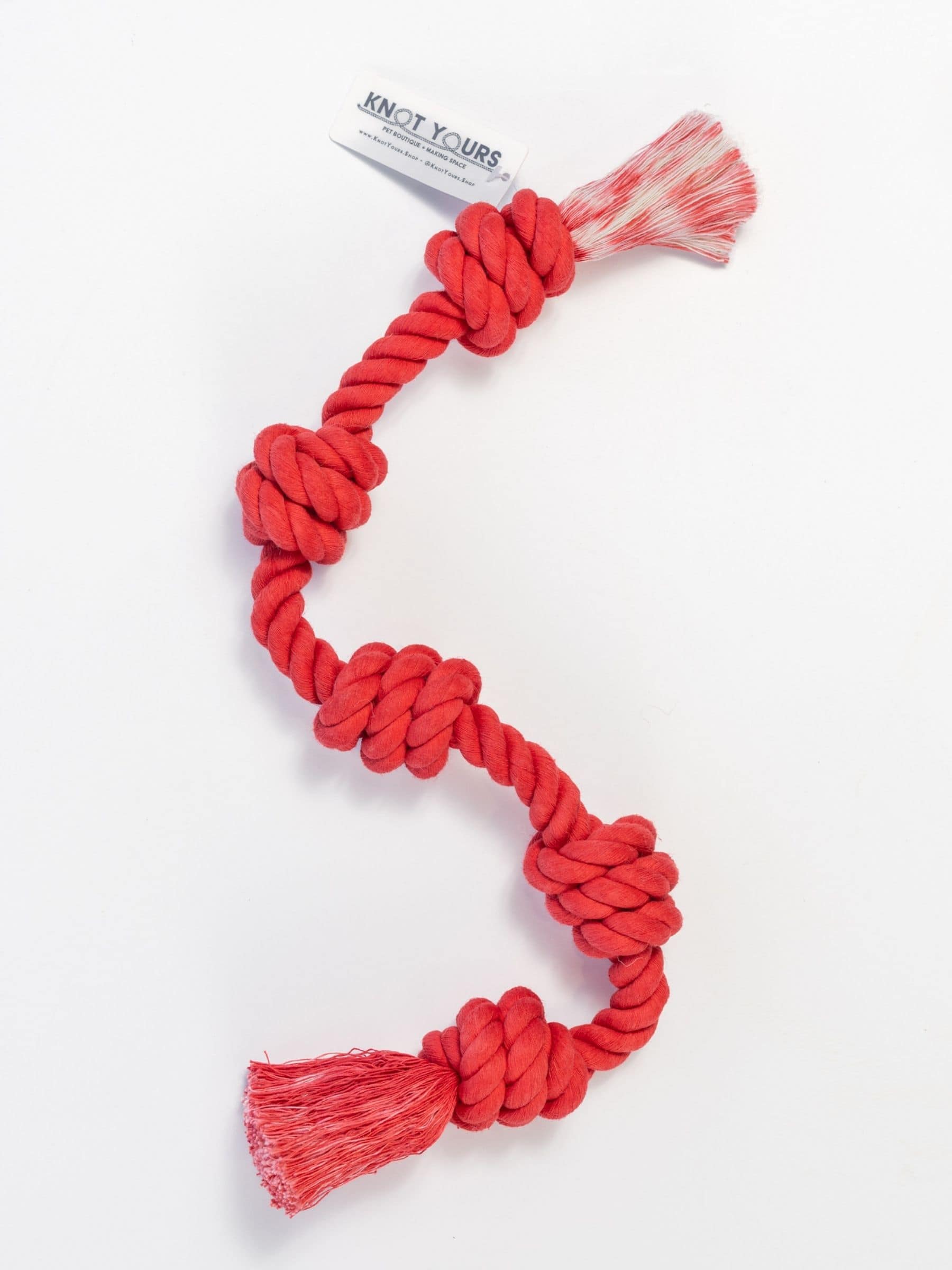 Red Little Gigantic dog rope toy with tassels perfect for tug and fetch play.