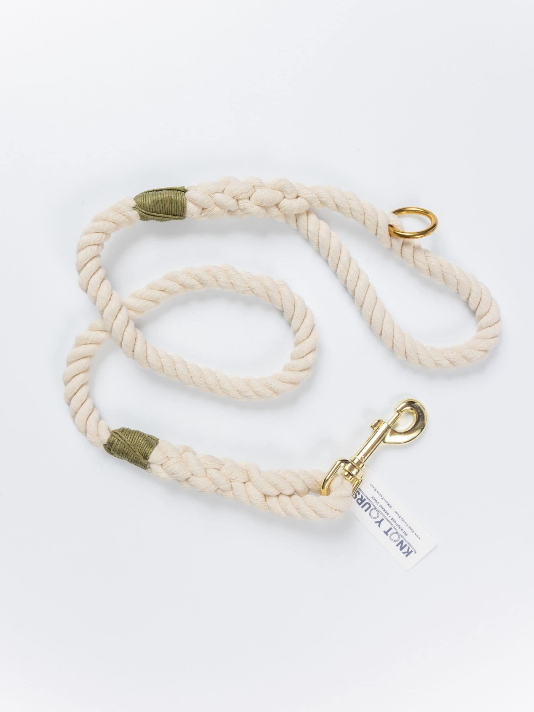 Custom natural rope dog leash with olive green whipping detail and brass clasp.