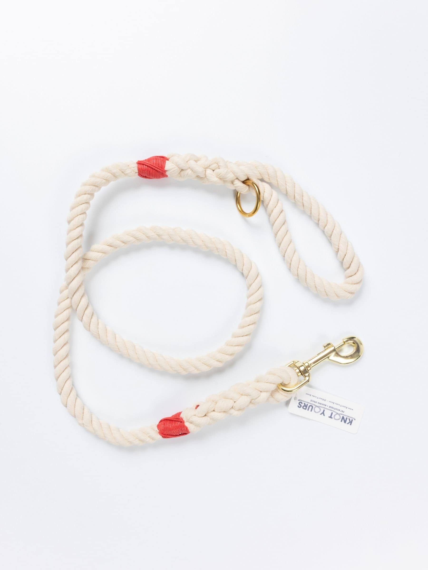 Custom natural rope dog leash with red whipping detail and brass clasp.