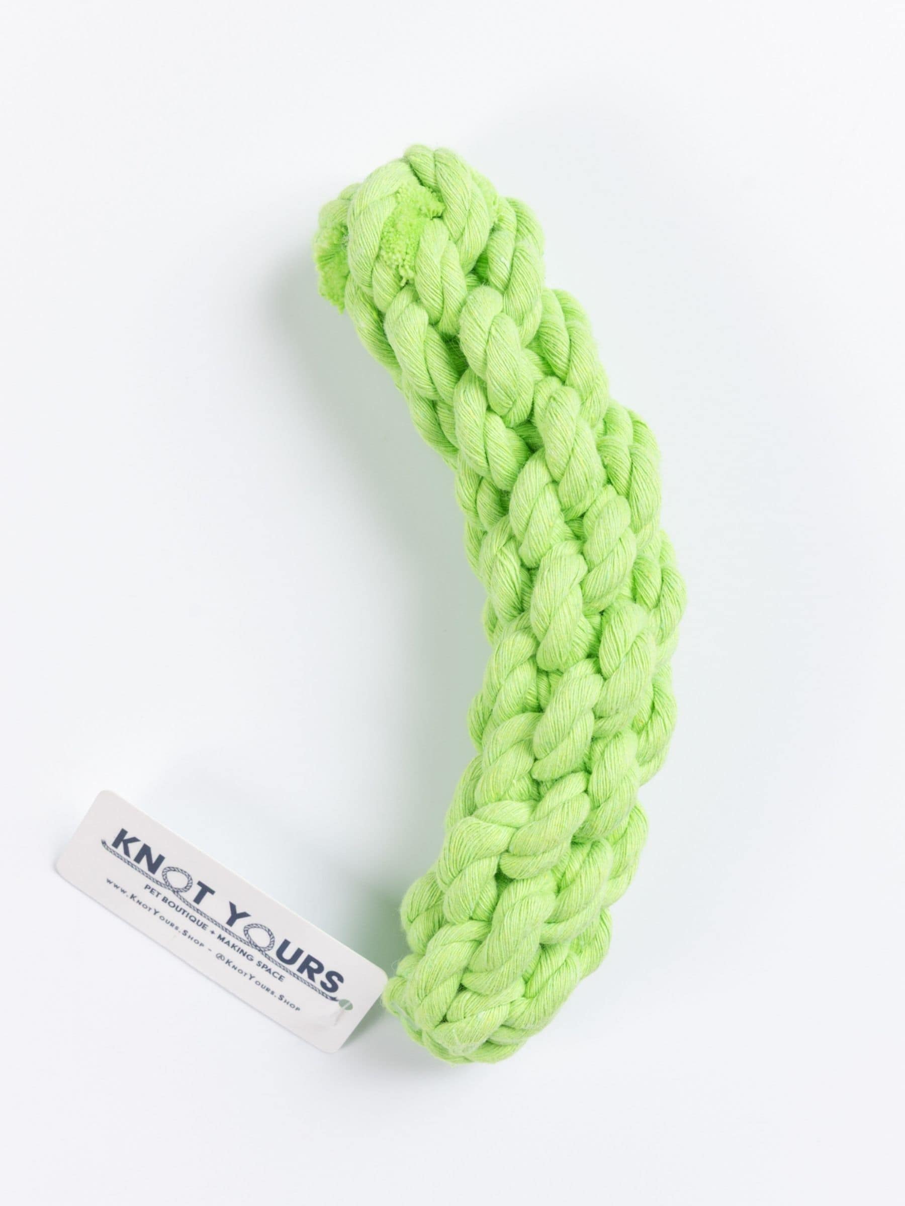 Bright green braided dog pickle rope toy with 'Knot Yours' tag on a white background
