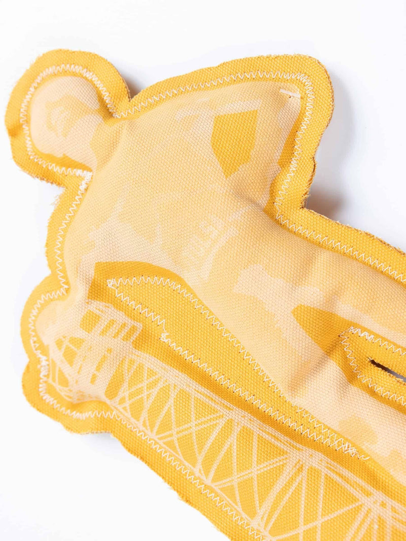 Close-up of Tulsa Driller squeaky dog toy showing fabric texture and detailed stitching of oil rig design.