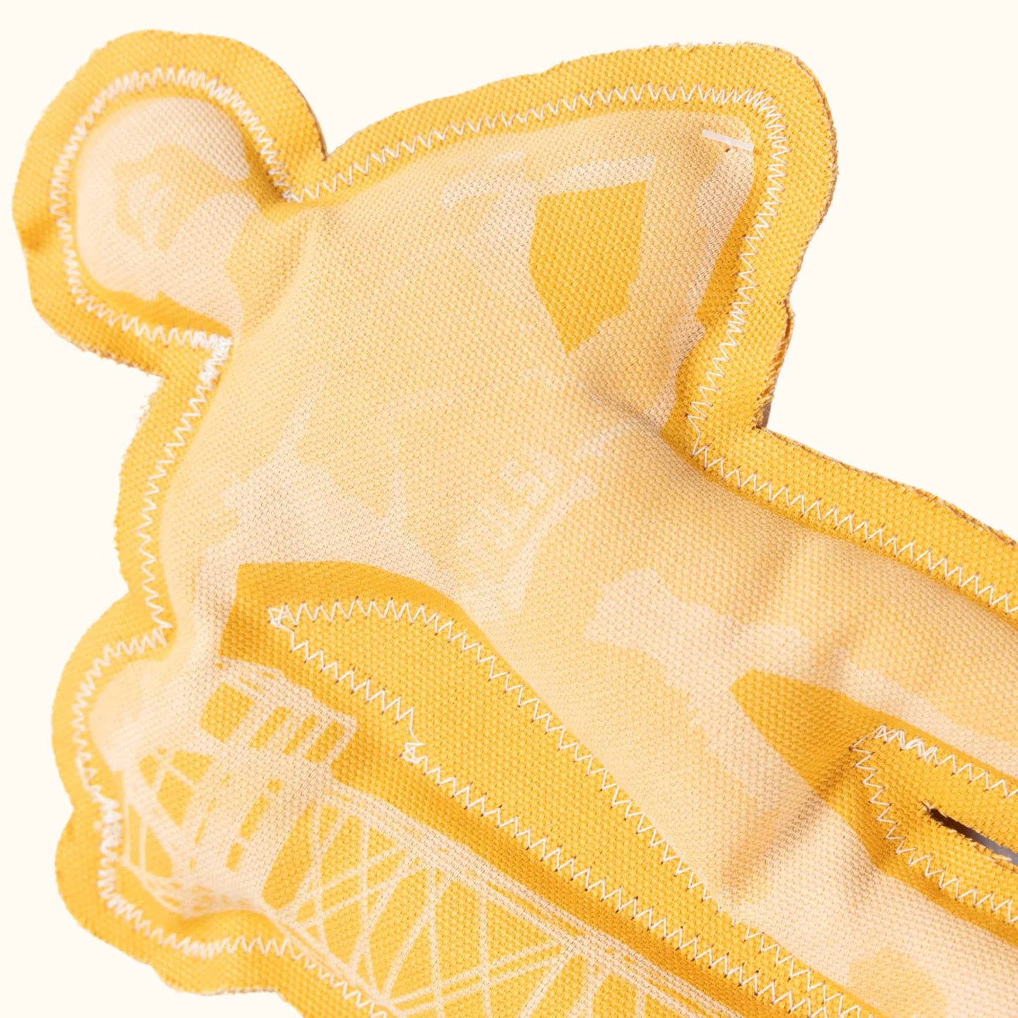 Close-up of Tulsa Driller squeaky dog toy showing fabric texture and detailed stitching of oil rig design.