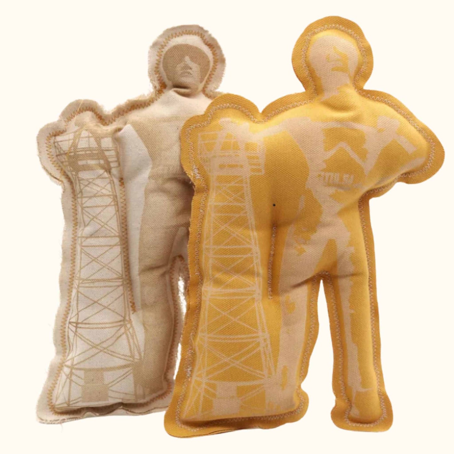 Two Tulsa Driller squeaky dog toys made from durable fabric, shaped like the iconic oil worker statue with tower graphic.