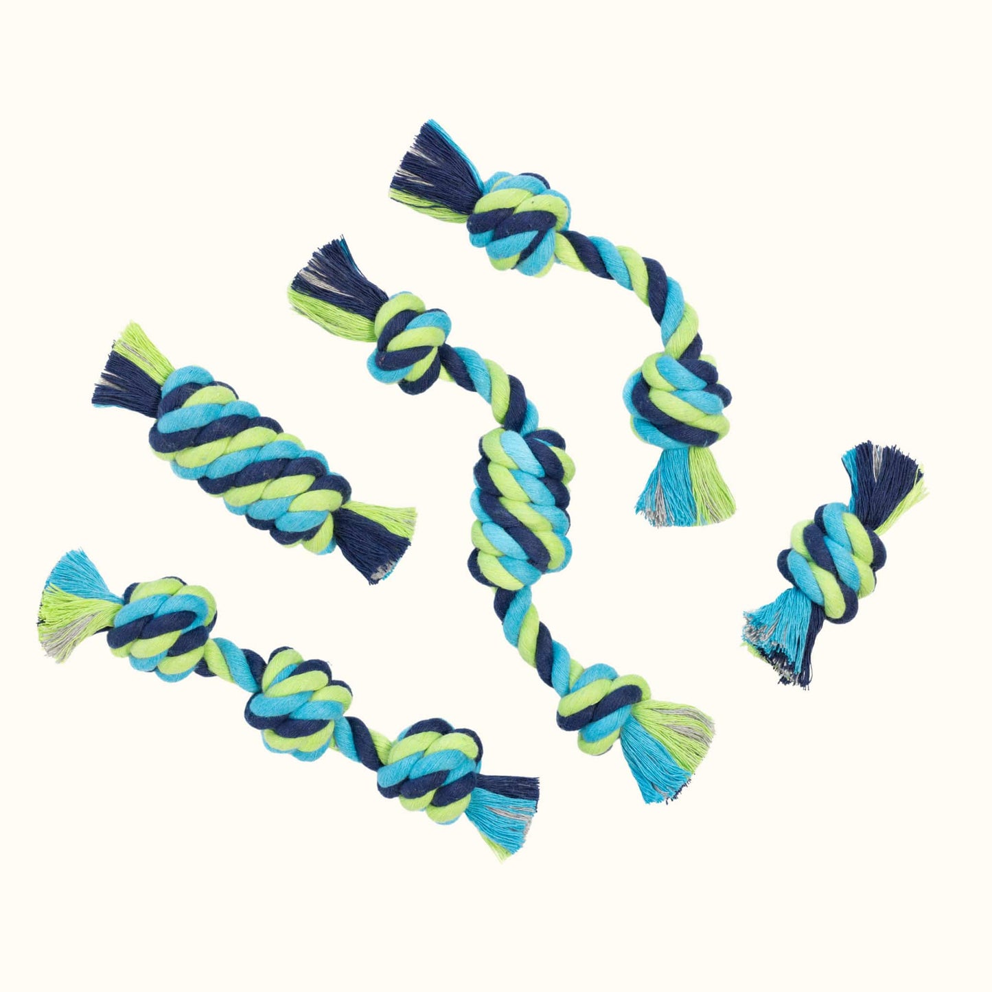 Assorted tiny dog rope toys in barbel, barrel, snitch, tube, and chain styles, all made from blue, green, and aqua hand-dyed cotton.