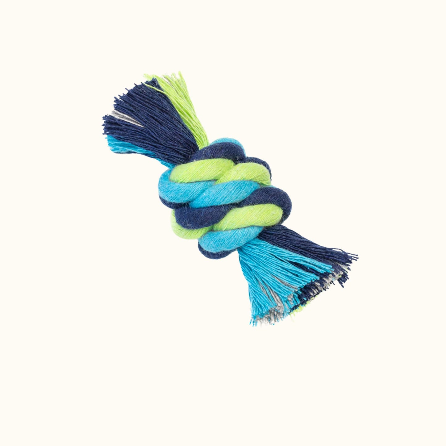 Compact knotted rope toy in a snitch shape, featuring vibrant green, turquoise, and navy cotton strands with fringed ends.
