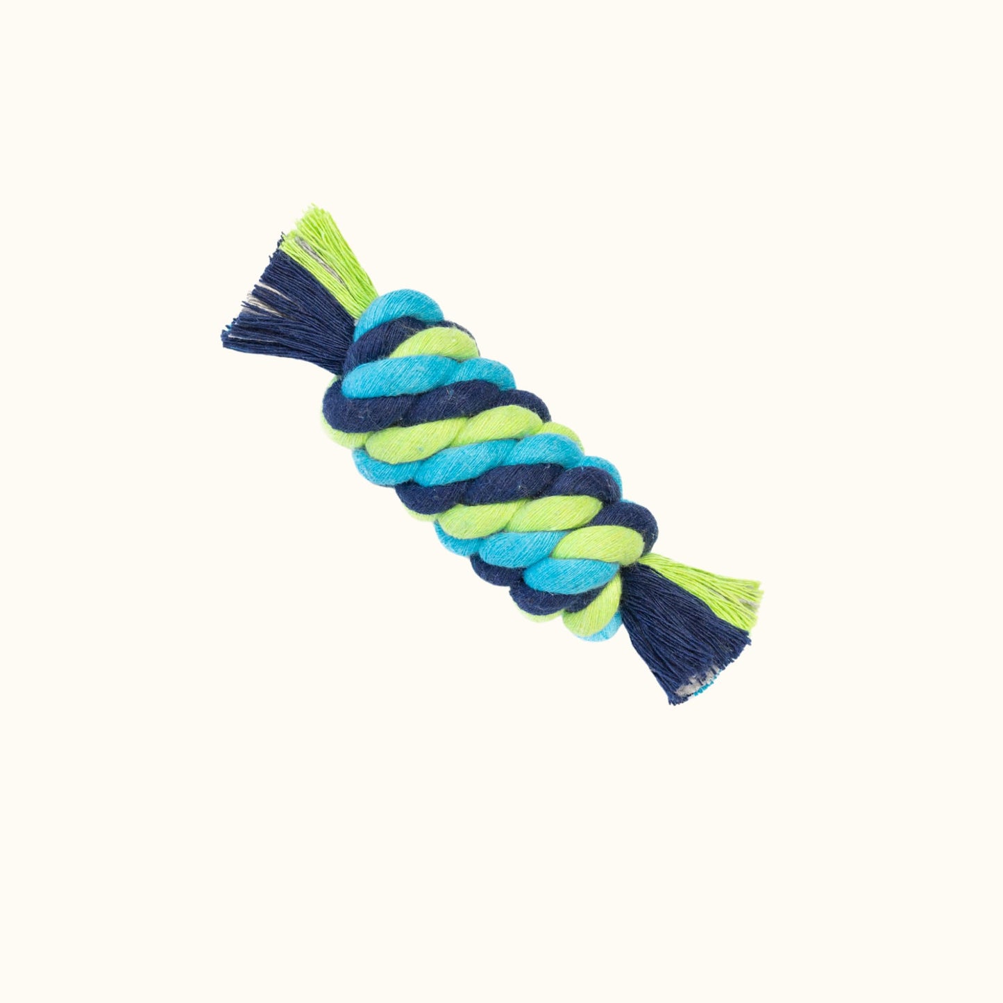 Small tube-shaped rope chew toy made from hand-dyed green, blue, and teal rope, tightly braided for durability.