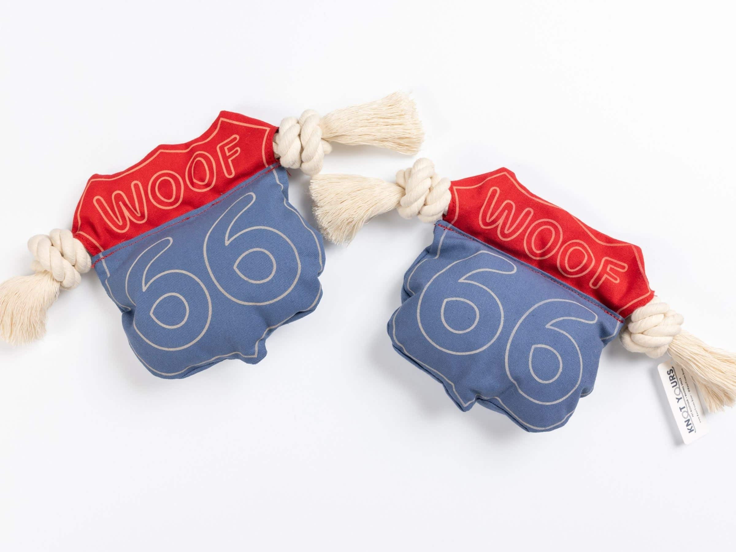 Red and blue dog chew toys with '66' and 'WOOF' text on blue and red canvas a white background