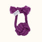 Giant Monkey Knot toy in rich eggplant purple, shown with a Knot Yours brand tag on the handle and textured cotton rope ends designed for play and durability.