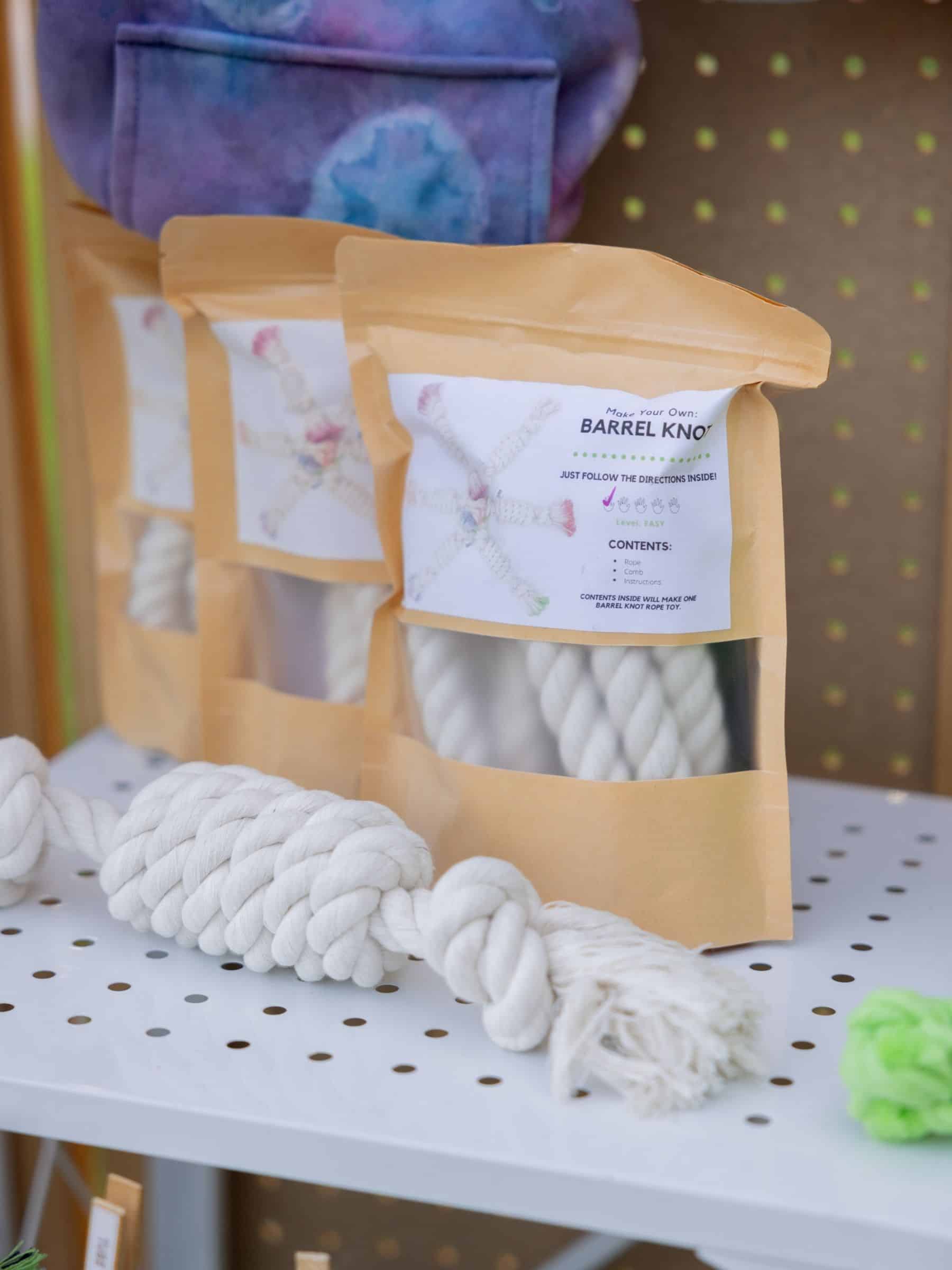 White rope toy with a 'Barrel Knot' packaging on a white surface.