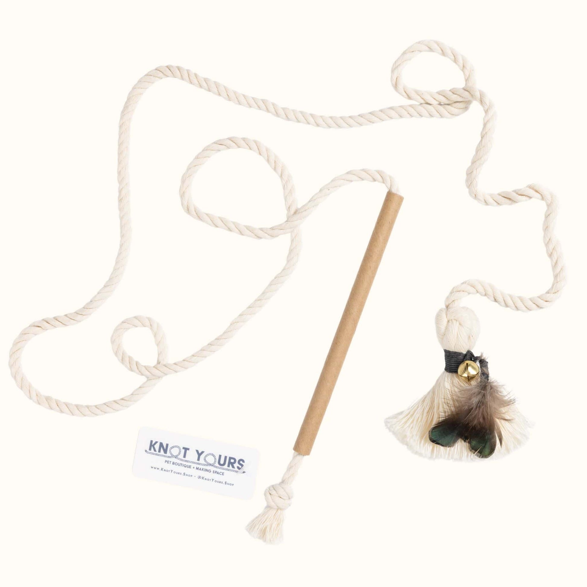 Interactive cat wand toy with a cardboard handle, long cotton rope, and black-banded feather tassel attachment for active play.
