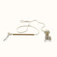 Interactive cat wand toy made with a natural rope, cardboard handle, and crinkle wings with bell for sensory play.