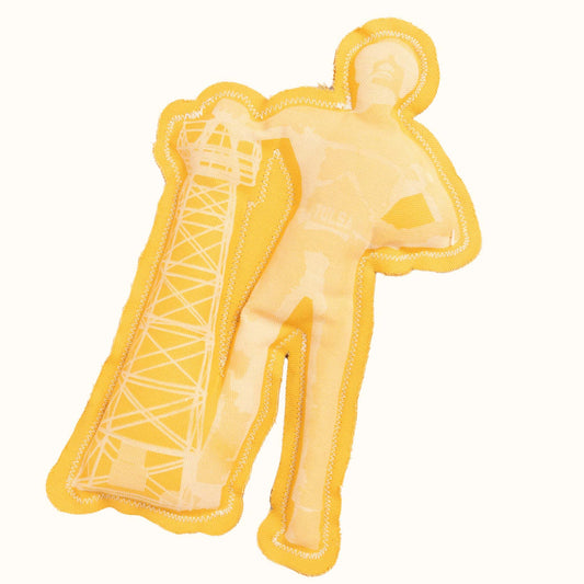 Golden Tulsa Driller squeaky dog toy in fabric, featuring oil worker statue design with oil rig tower.