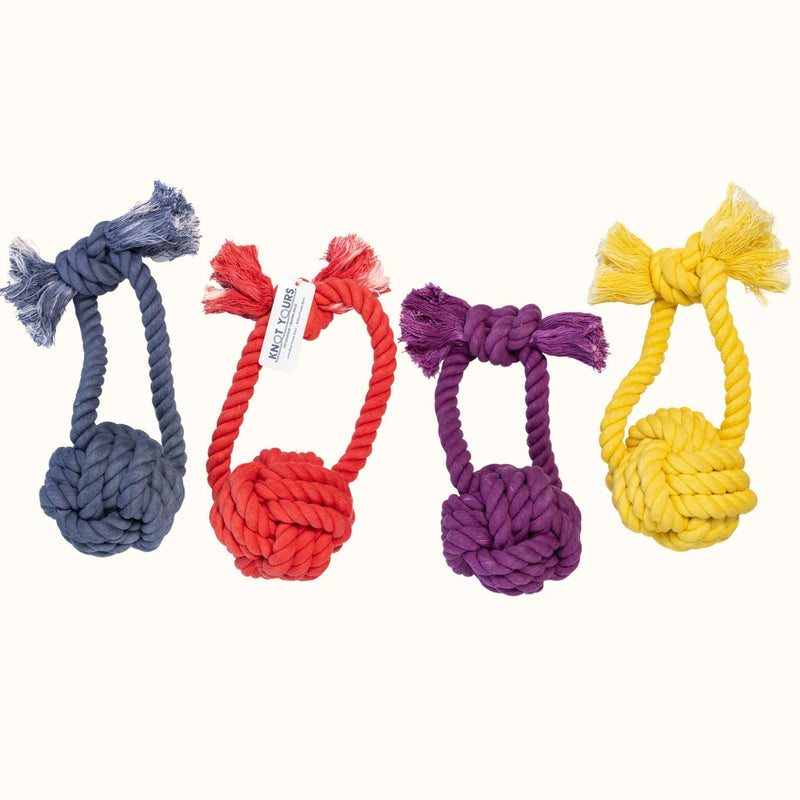 Set of Knot Yours Giant Monkey Knot toys in navy, red, eggplant, and yellow, each designed with a thick rope handle and oversized knot for large dogs.