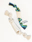 Natural color and multicolored dog chew toy with rope and bone on a white background