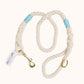 Handmade natural cotton dog leash with baby blue whipping and brass hardware.