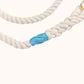 Close-up of natural cotton rope dog leash showing aqua whipping detail