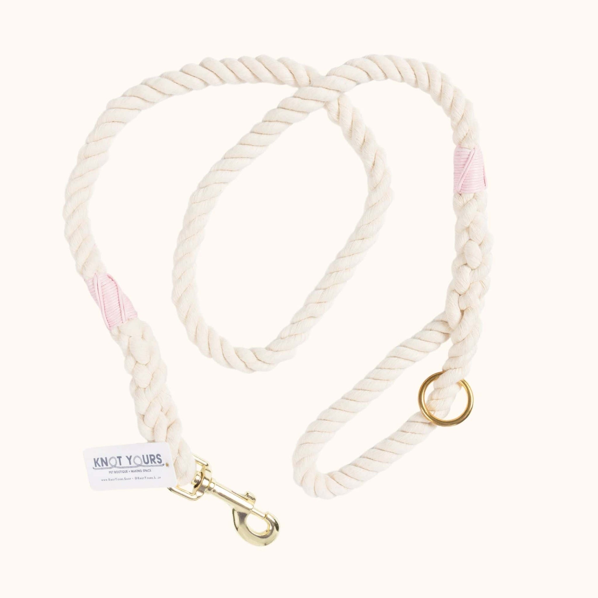 Custom natural rope dog leash with light pink whipping detail and brass clasp.