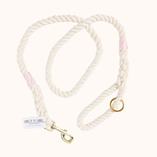 Custom natural rope dog leash with light pink whipping detail and brass clasp.