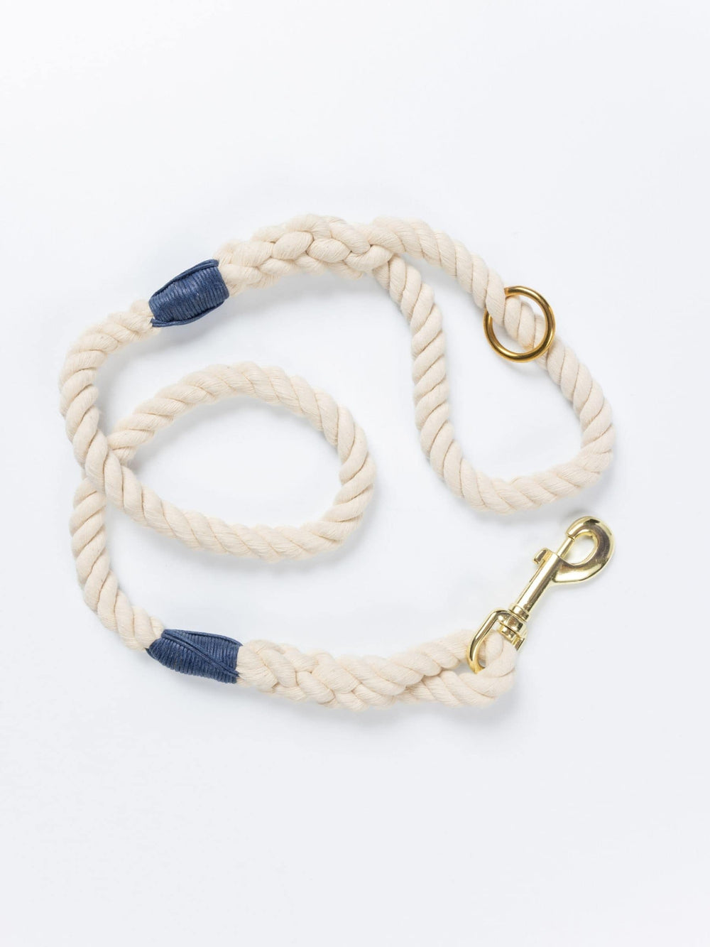 Handmade natural rope dog leash with navy blue whipping detail and brass clasp.