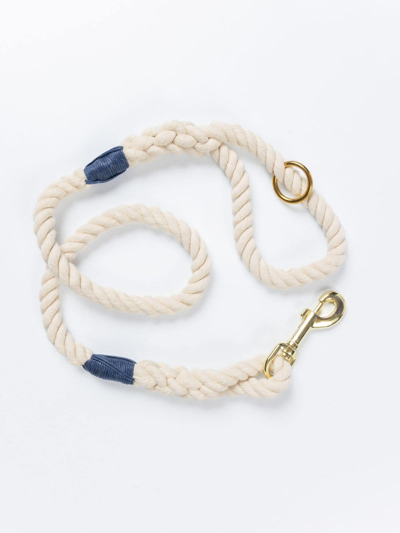 Handmade natural rope dog leash with navy blue whipping detail and brass clasp.