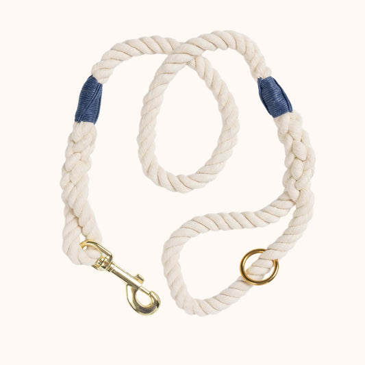 Handmade natural rope dog leash with navy blue whipping detail and brass clasp.