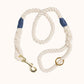 Handmade natural rope dog leash with navy blue whipping detail and brass clasp.
