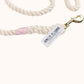 Handmade natural rope dog leash with light pink whipping and sturdy brass hardware