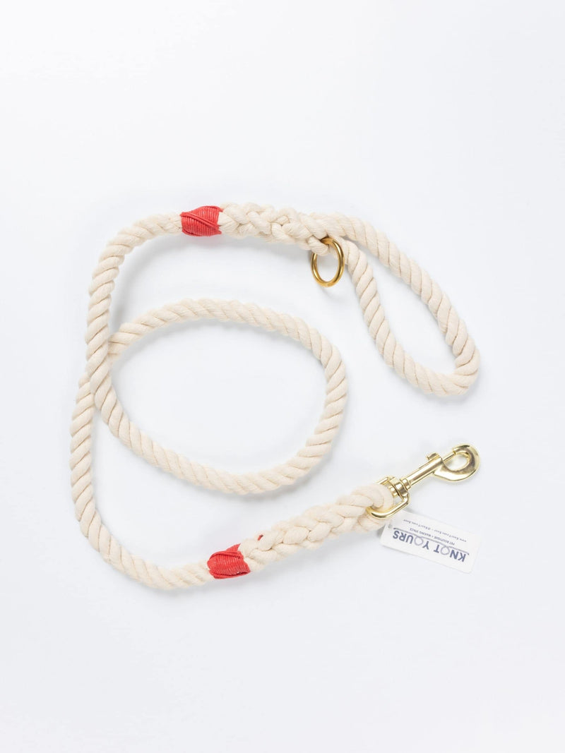Custom natural rope dog leash with red whipping detail and brass clasp.