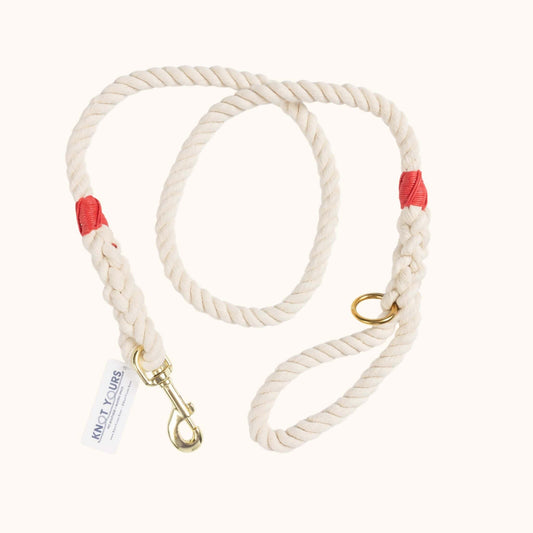 Custom natural rope dog leash with red whipping detail and brass clasp.