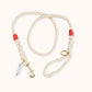 Custom natural rope dog leash with red whipping detail and brass clasp.