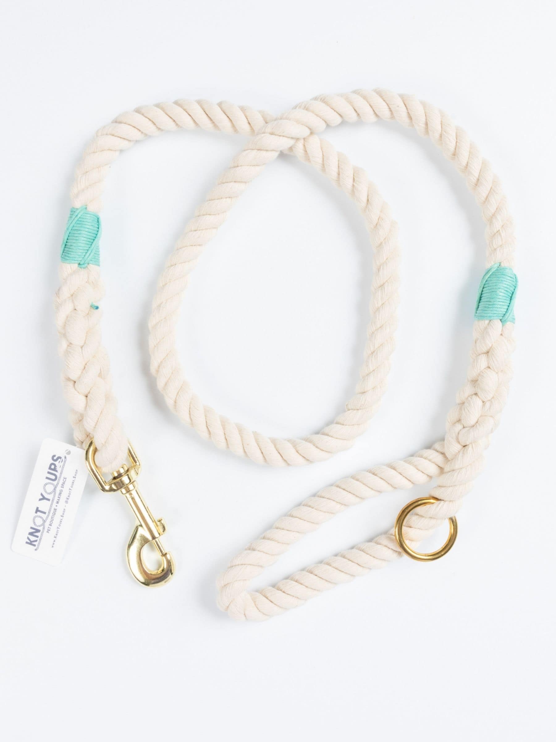 Custom natural rope dog leash with turquoise whipping detail and brass clasp.