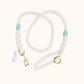 Custom natural rope dog leash with turquoise whipping detail and brass clasp.