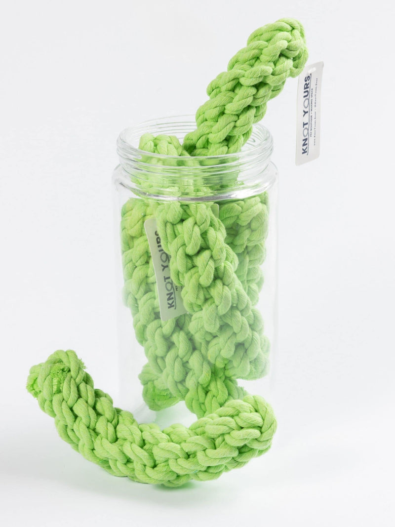 Green braided rope toy with a clear jar on a white background