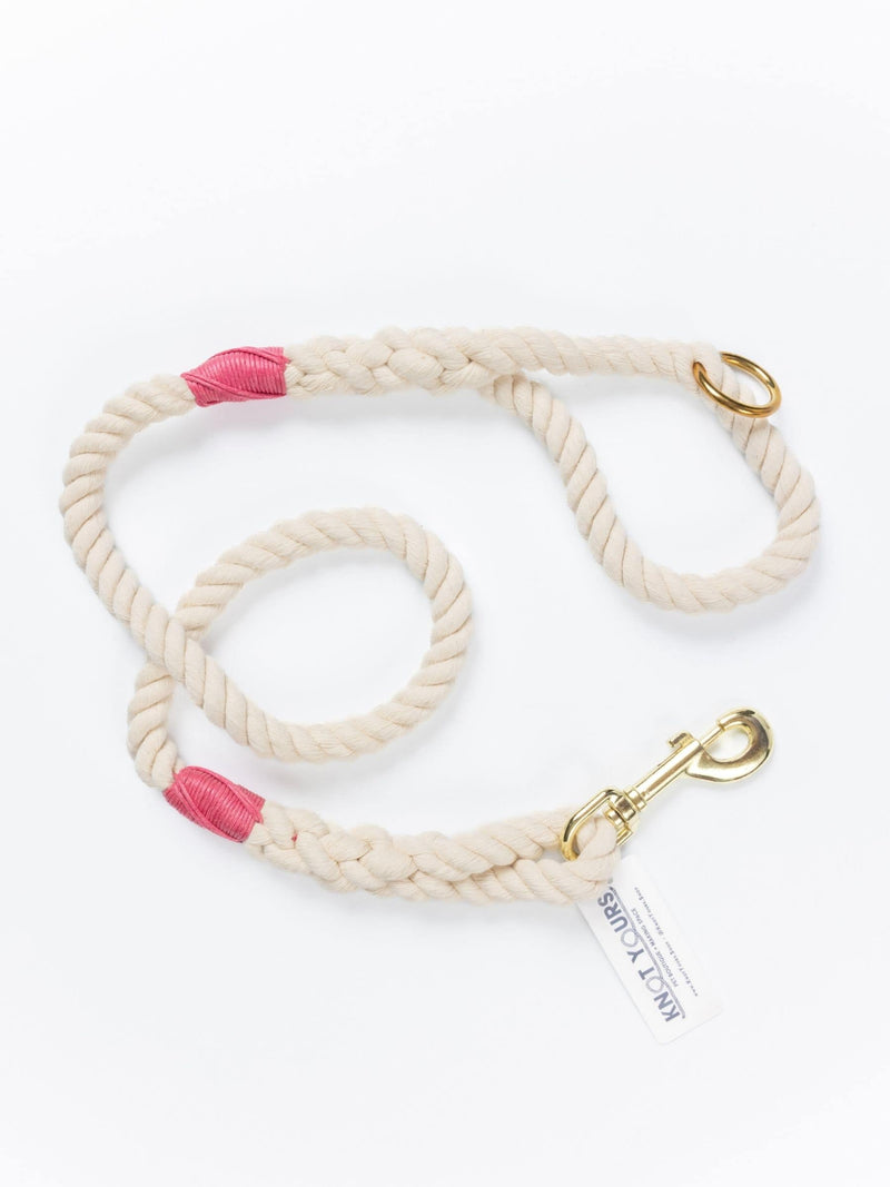 handmade natural rope dog leash with fuchsia whipping detail and brass clasp.