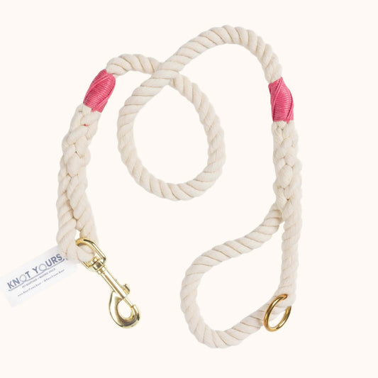 handmade natural rope dog leash with fuchsia whipping detail and brass clasp.