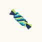 Small tube-shaped rope chew toy made from hand-dyed green, blue, and teal rope, tightly braided for durability.