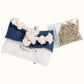 Back view of Tulsa Flag Catnip Pillow with knotted rope closure and bag of organic catnip refill.