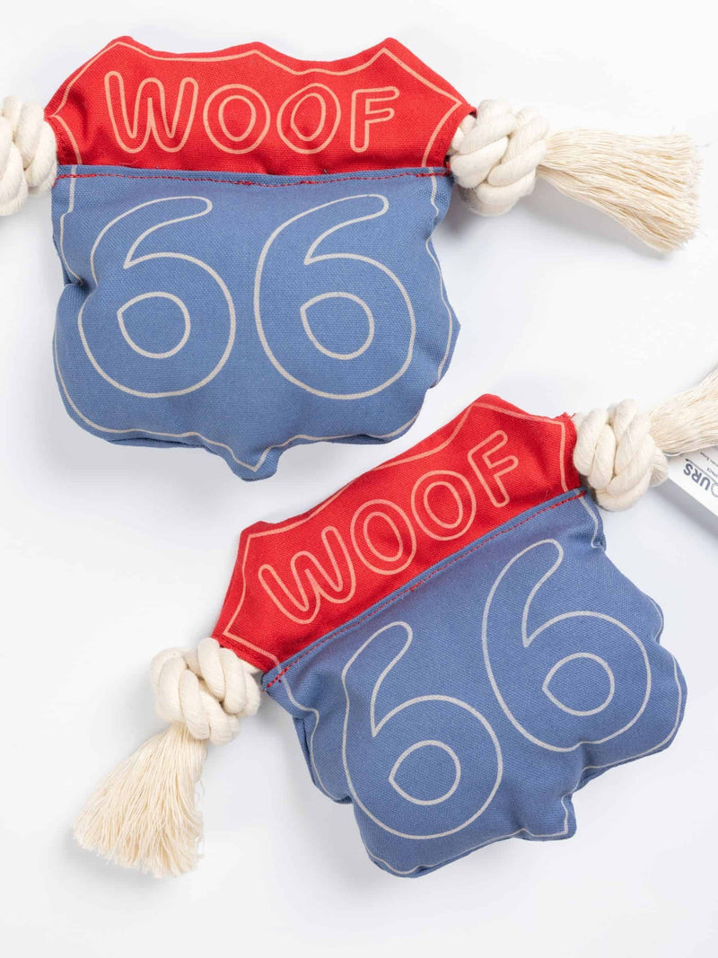 Two woof 66 dog tug toy with a red and blue canvas body and rope ends, perfect for interactive tug games and solo play.